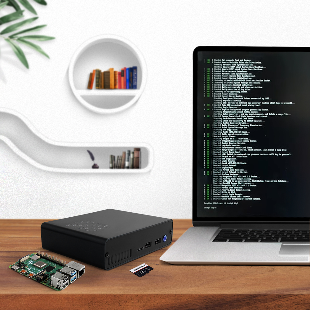 DeskPi Pro on a desk next to laptop